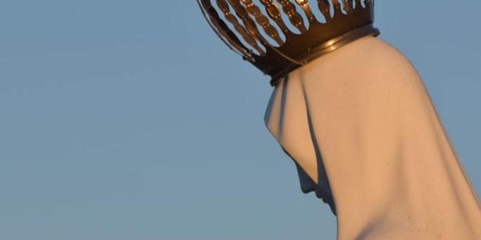 photo by mateus campos felipe white Virgin Mary statue with gold crown